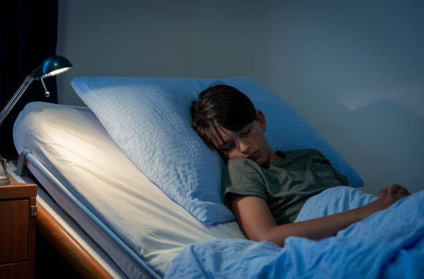 istock The boy is looking at the mobile phone 1410969615