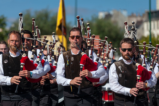 Quimper, France - July 24 2022: Musicians of the Bagad Cap Caval from Plomeur during the Cornouaille festival.