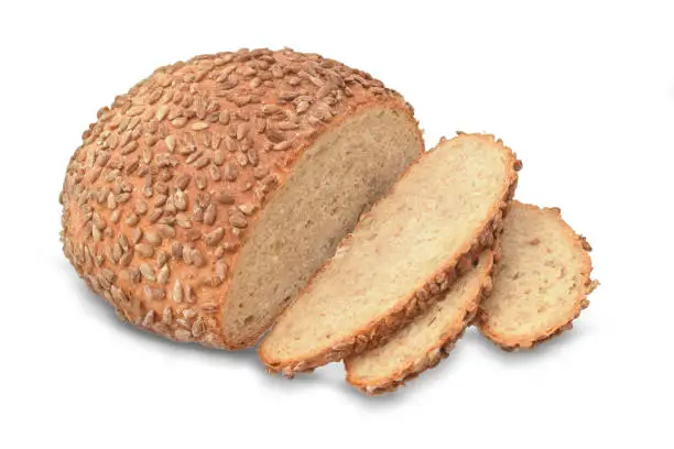 Wheat bread and loafs coated with sunflower seeds isolated on white