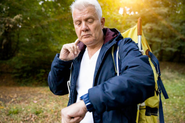istock Senior men is having fun while hiking stock photo 1410975059