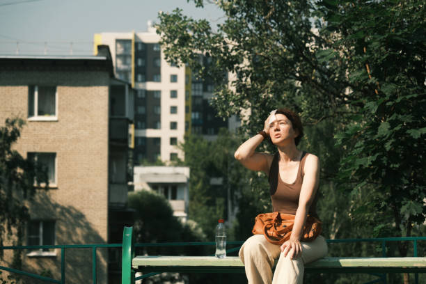 Woman suffering from heat wave