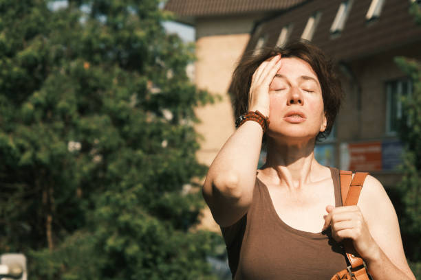 Woman suffering from heat wave
