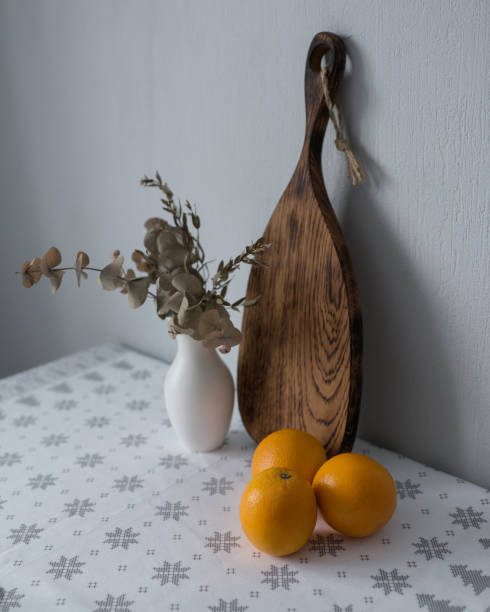 istock Kitchen equipment, wooden board and oranges. 1410977594