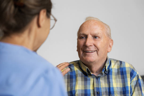 istock Nursing Home - Caregiver with Senior Man 1410979258