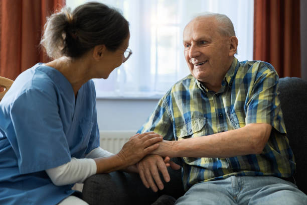 istock Nursing Home - Caregiver with Senior Man 1410979326