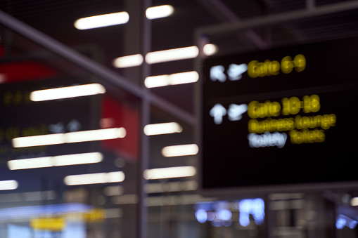 Blurred international airport interior background with bokeh and copy space