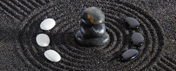 istock Japanese zen garden with stone and textured sand 1410982729