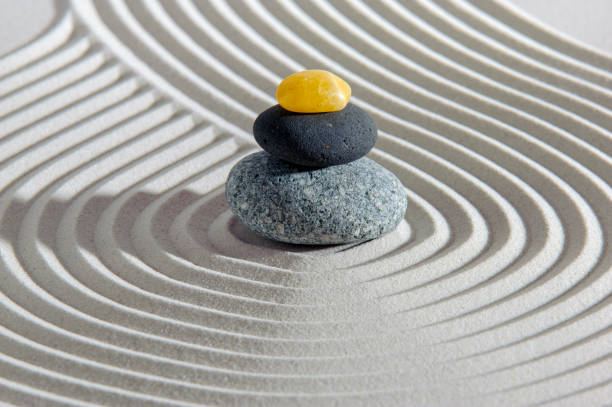 istock Japanese zen garden with stone and textured sand 1410982796
