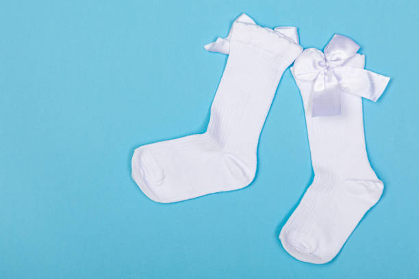 istock high white children's socks with big bows for festive clothes on a blue background 1410985198
