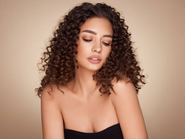 istock Beautiful smiling woman with afro curls 1410988442