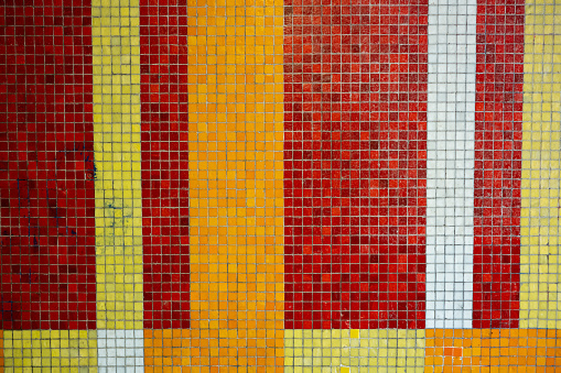 Colorful abstract mosaic wall texture, no people.