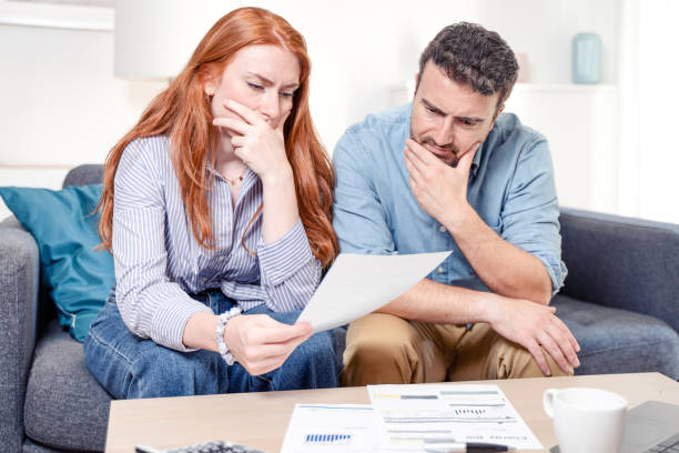 istock Couple managing the debt unable to pay out loans 1410988879