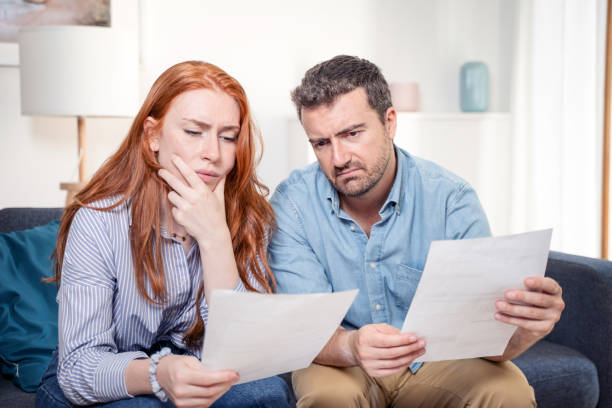 istock Couple managing the debt unable to pay out loans 1410989743