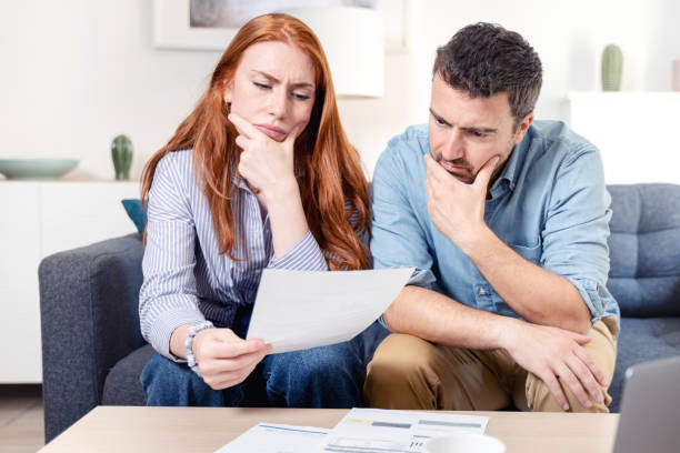 istock Young caucasian couple having debt problems after home expenses 1410989801