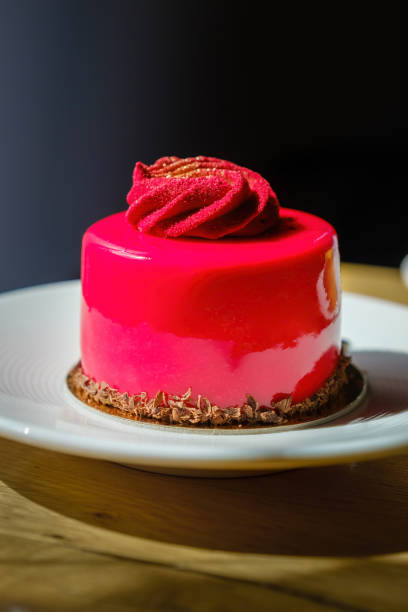 istock Cake mousse with sweet icing. Red cake with strawberry mousse. 1410991469