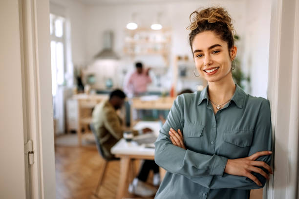 istock Young beautiful businesswoman posing in small office 1410992955