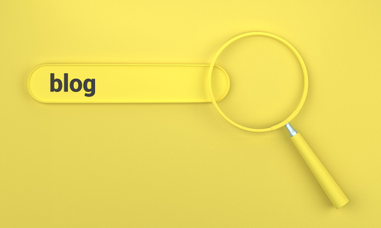 Searching for Blog in search bar with magnifying glass. SEO concept on yellow background.