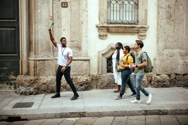 istock Tour guide with a group of tourists 1410994895