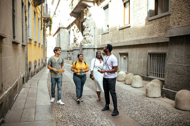 istock Tour guide with a group of tourists 1410994909