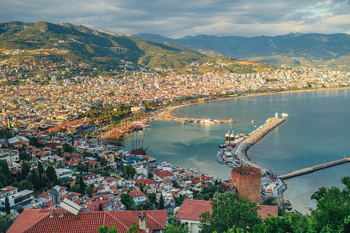 Arial view to beautiful Alanya, Red Tower (Kizil Kule), marina, Mediterranean sea and mountains, Turkey