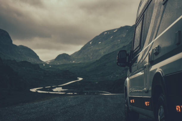 istock Camper Van RV on a Rainy Scandinavian Road 1410996559