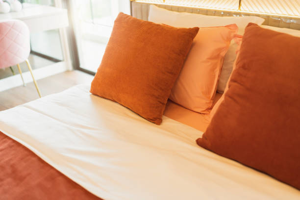 istock bedroom interior design close up,home interior concept soft pillow arrange on king size white blanket mattress in bedroom with white curtain background home sweet home interior ideas 1410996795