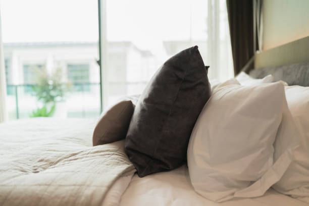 istock bedroom interior design close up,home interior concept soft pillow arrange on king size white blanket mattress in bedroom with white curtain background home sweet home interior ideas 1410997651