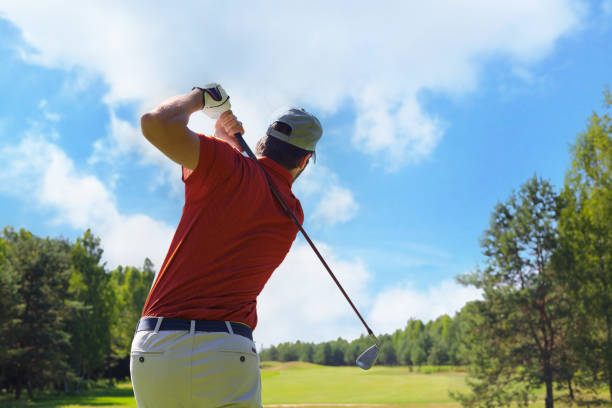 istock Golfer hitting golf shot with club on course while on summer vacation. 1410997882