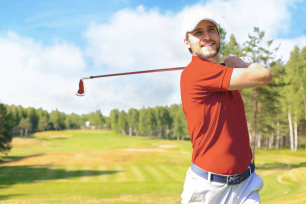 istock Golfer hitting golf shot with club on course while on summer vacation. 1410997943