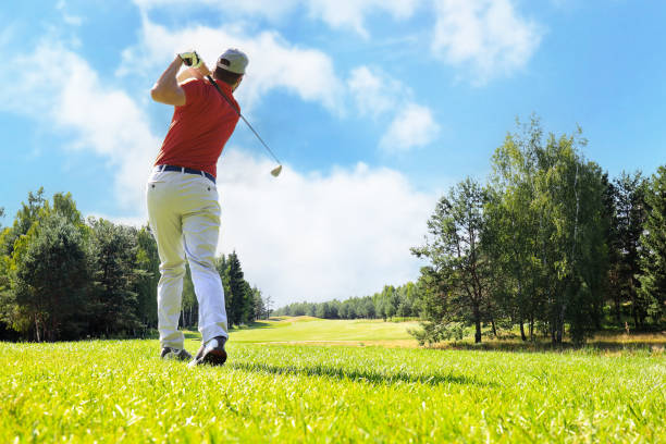 istock Golfer hitting golf shot with club on course while on summer vacation. 1410997990