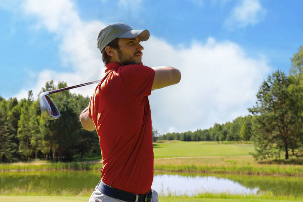 istock Golfer hitting golf shot with club on course while on summer vacation. 1410998062