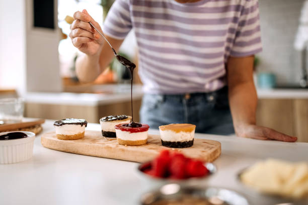 istock Putting chocolate topping on a cakes 1410999139