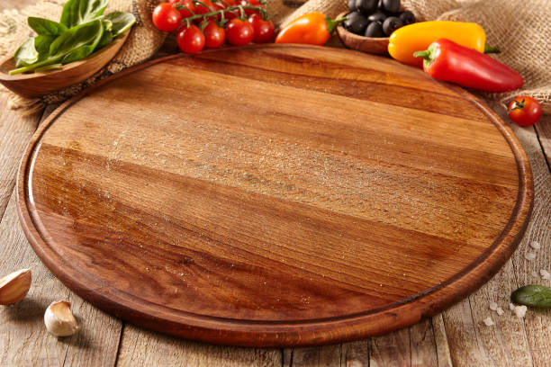 istock Cutting board on wooden surface 1410999273