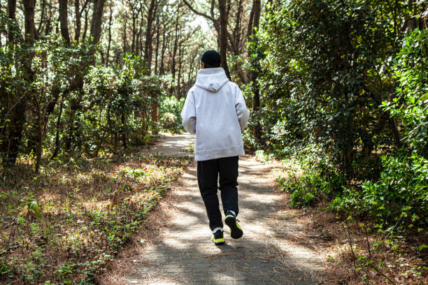 istock Japanese man jogging in forest. 1410999355