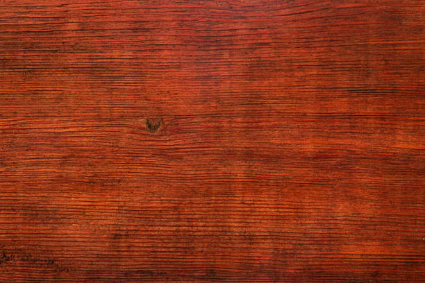Dark brown natural textured wooden background.