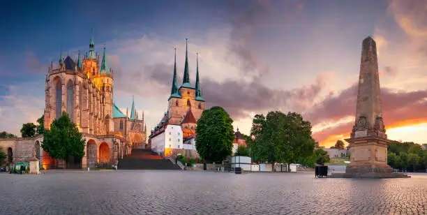 Cityscape image of downtown Erfurt, Germany with Erfurt Cathedral at summer sunset.