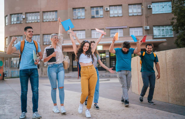 Students celebrating the end of a school year stock photo