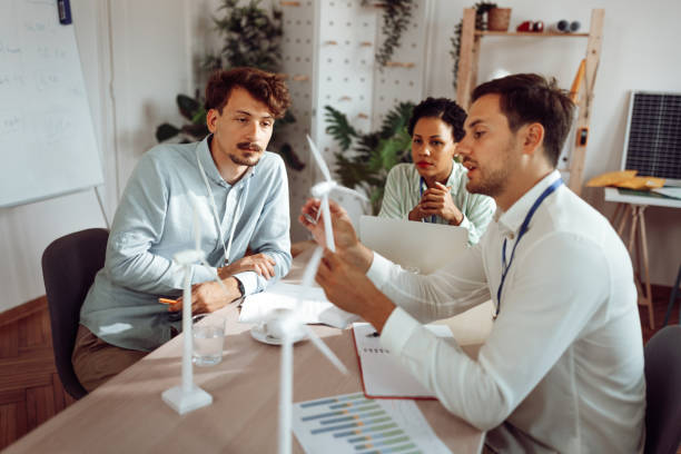 istock Team  of engineers working on renewable energy in the office 1411001678
