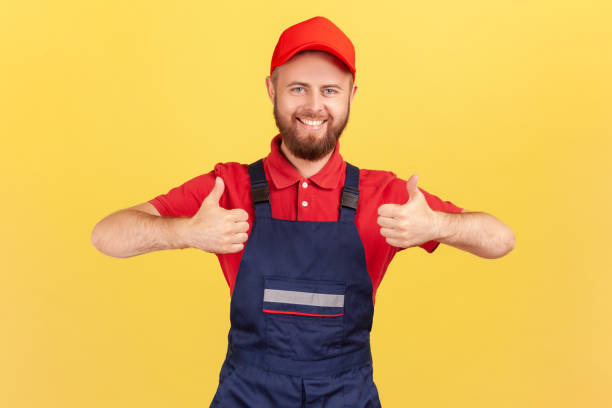 istock Satisfied worker man standing and looking at camera, showing thumbs up, expressing happiness. 1411001805