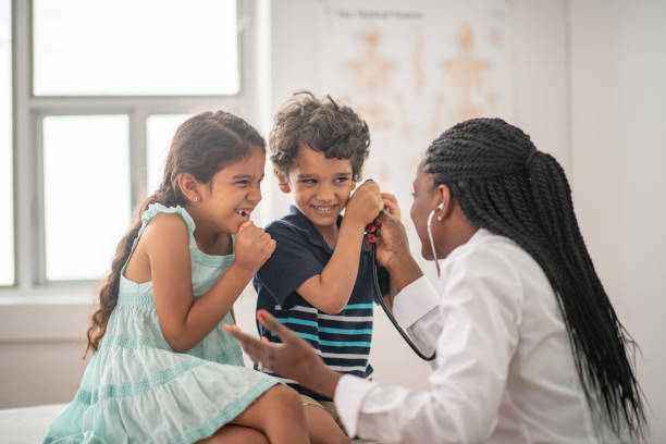 istock African Doctor with Two Children 1411002280