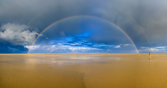 Rainbow at the beach on Texel island in the Wadden sea region