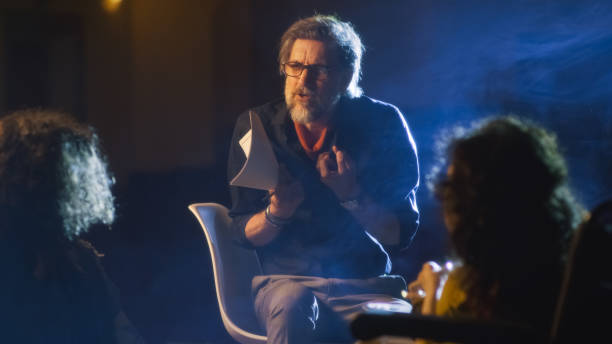 istock Director talking with actors during rehearsal 1411002469