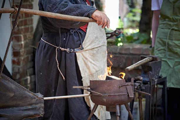 istock A closeup of a blacksmith fanning a flame 1411003481