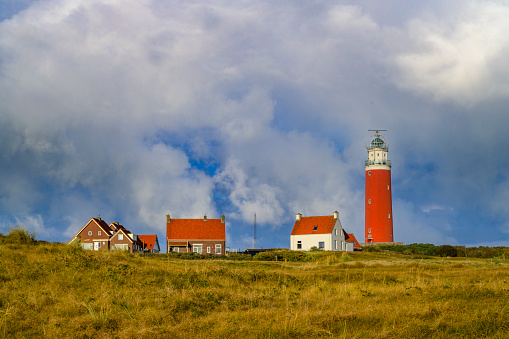 Lighthouse at the Wadden island Texel in the dunes with during a stormy autumn morning. The Eierland lighthouse is located at the North point of the island.