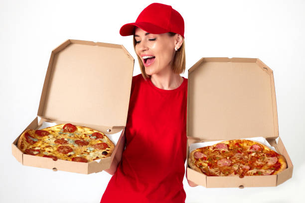istock pizza delivery girl showing pizza inside boxes 1411004838