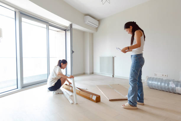istock Two asian women assembling furniture together 1411005335