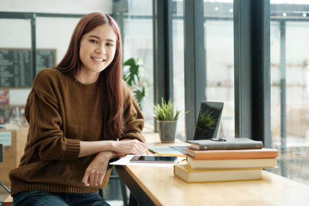 istock Young women study in front of the laptop computer at home. 1411005790