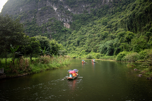 Wooden raft in the middle of idyllic blue lagoon in tropical setting