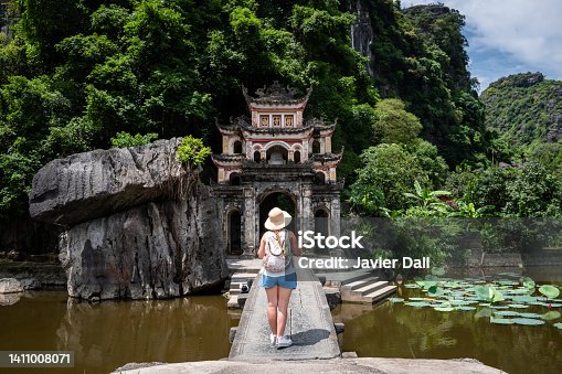 istock Tourist walking around Bich Dong Pagoda, Ninh Binh, Vietnam. 1411008071