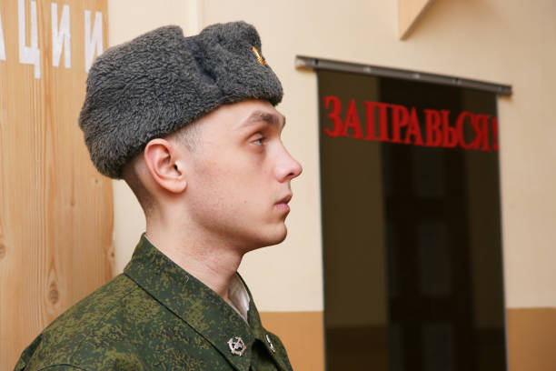Views of St. Petersburg and Moscow Saint Petersburg-Russia - 16.06.2022: A soldier of the Russian army near the mirror with the inscription Refuel. russian military photos stock pictures, royalty-free photos & images